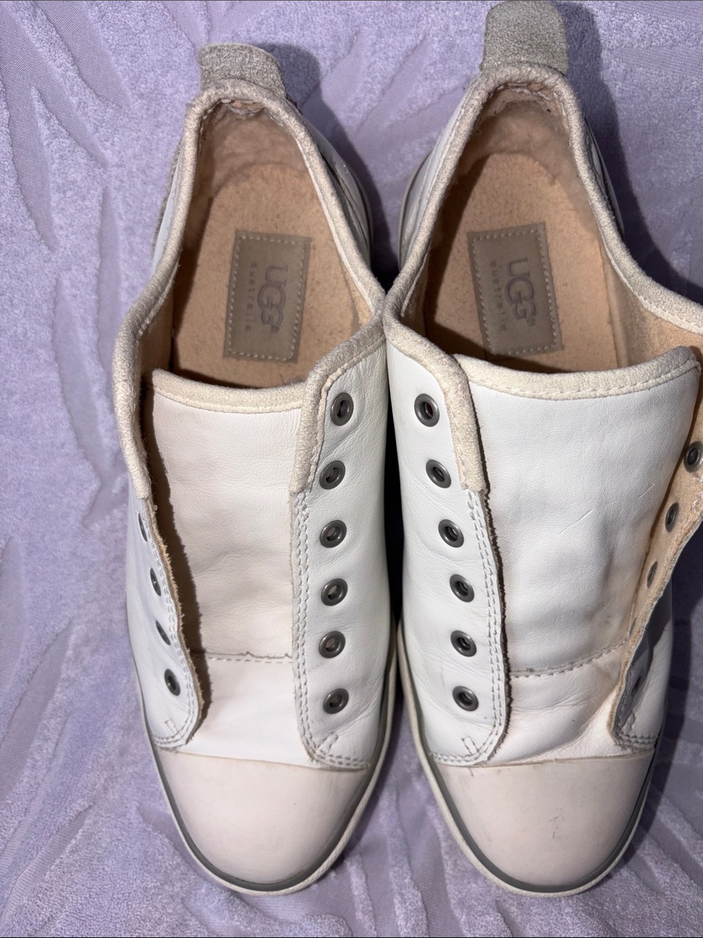 UGG White Slip-On Leather Sneakers with Metal Eyelets